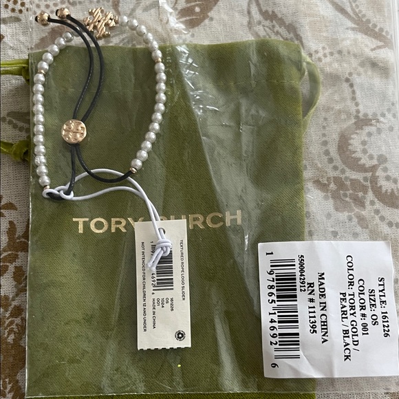 NWT Tory Burch Gold and Pearl Bracelet with black slider bracelet.Unopened